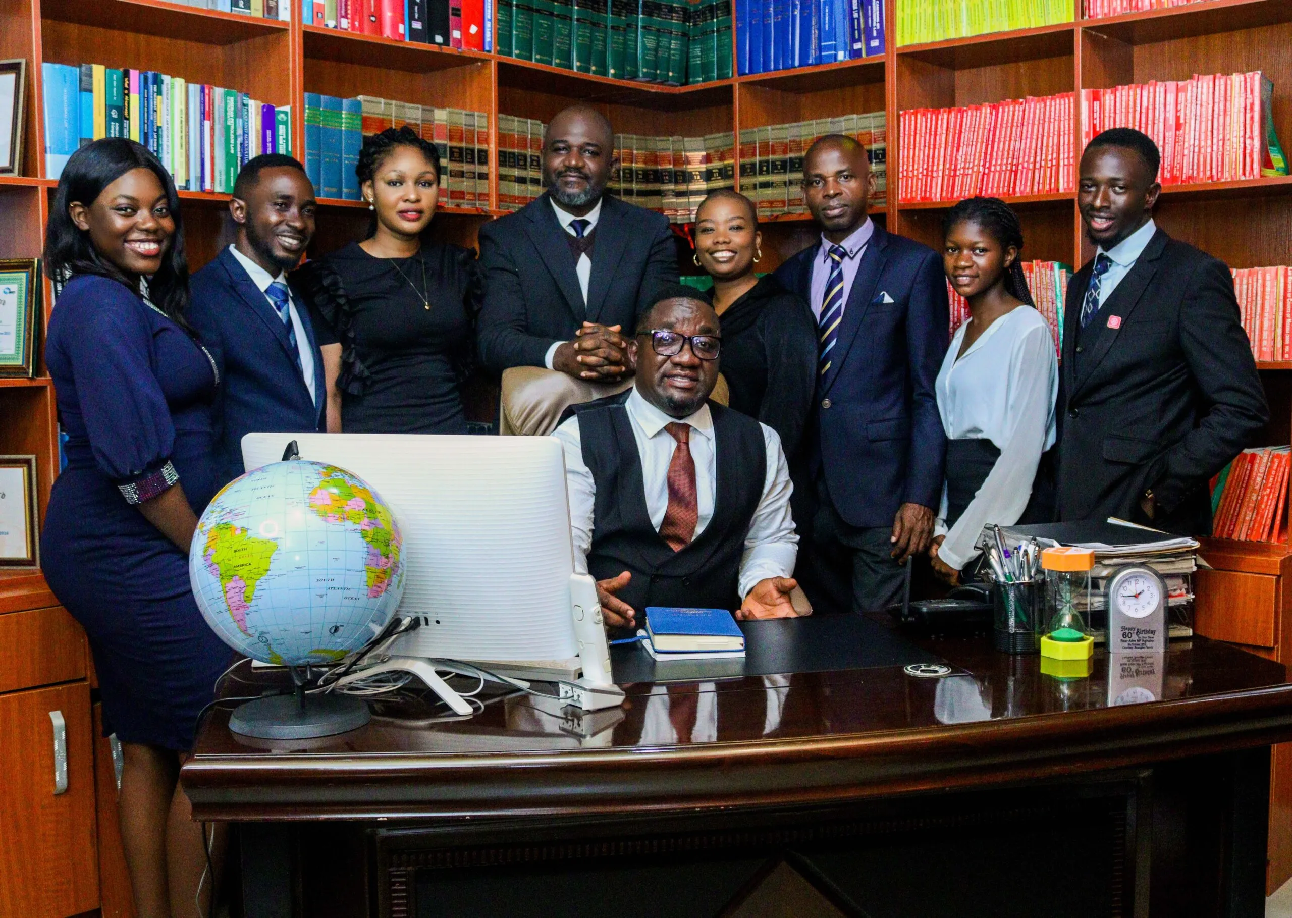 Osuya and Osuya lawyers together in their law office